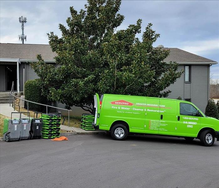 SERVPRO car in front of house