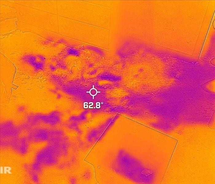 Infrared camera image of moisture on floor.